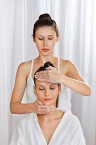 Masseuse Giving Head Massage To Woman